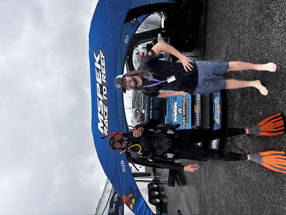 A Cafe Escalon partner conversation at a trackside team footprint